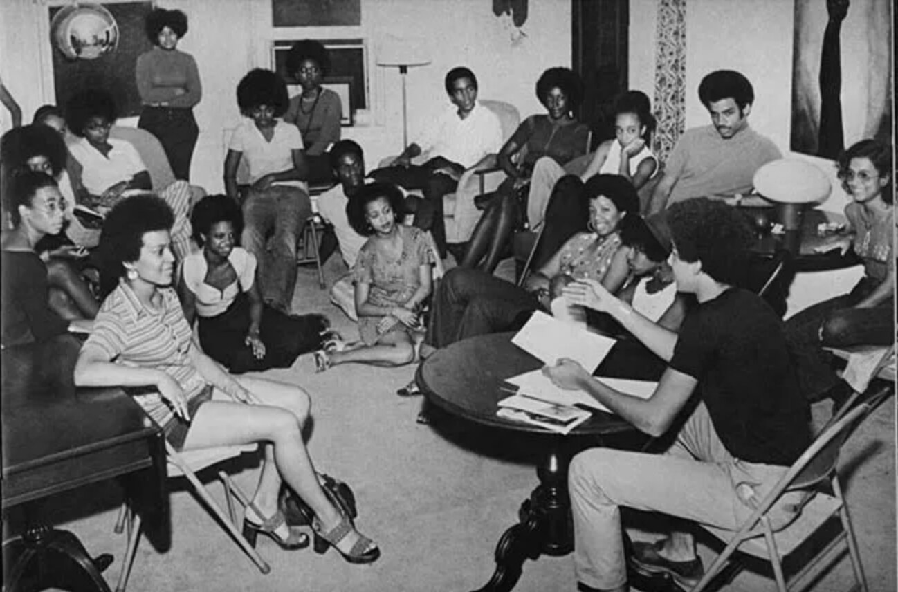 A crowded black-and-white photograph of students gathered inside Swarthmore's Black Cultural Center.